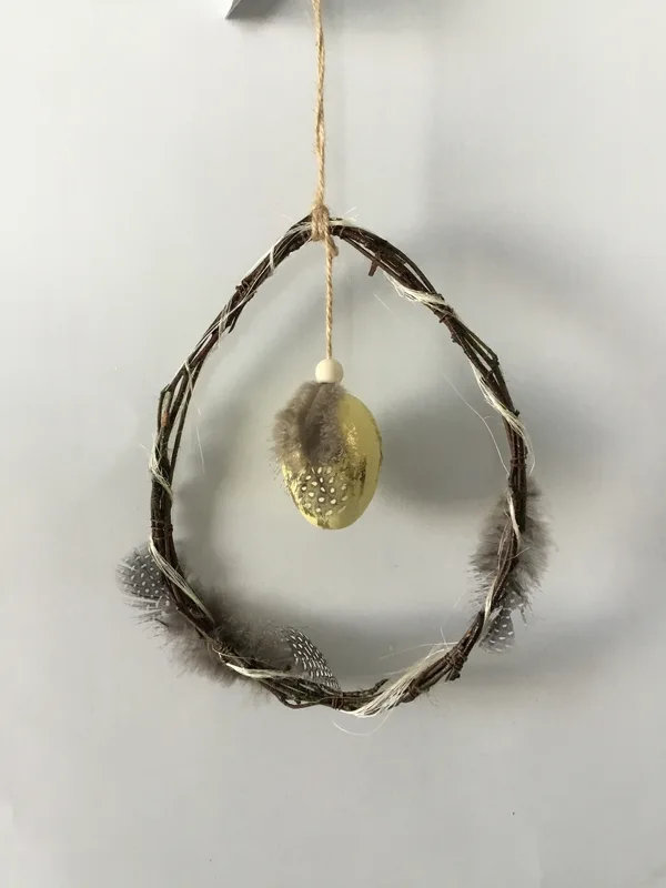 Twig hanger with egg and feather