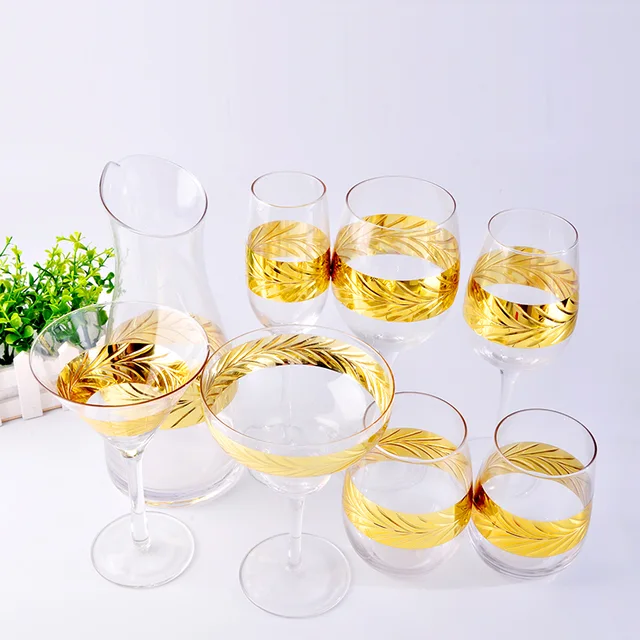 1 glass decanter and 7 glass drinkware with engraving golden pattern