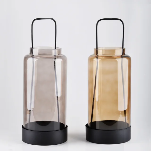 Glass candleholder with metal frame