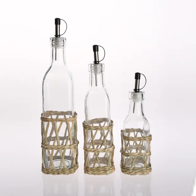 Straw plaiting glass oil bottle with glib