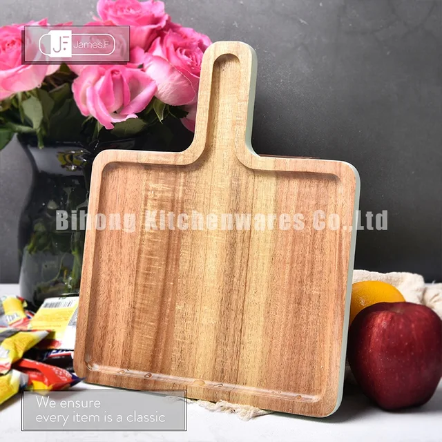 Paddle shaped acacia wood tray