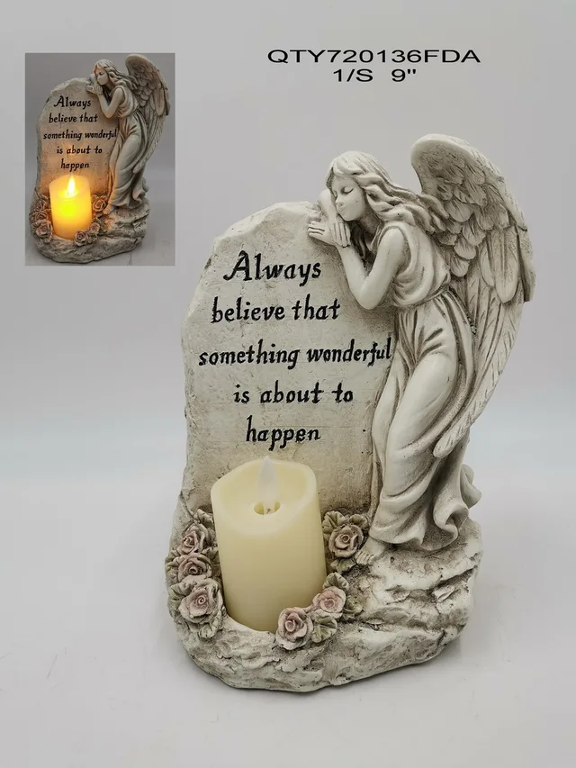 Cemetery angel with candle