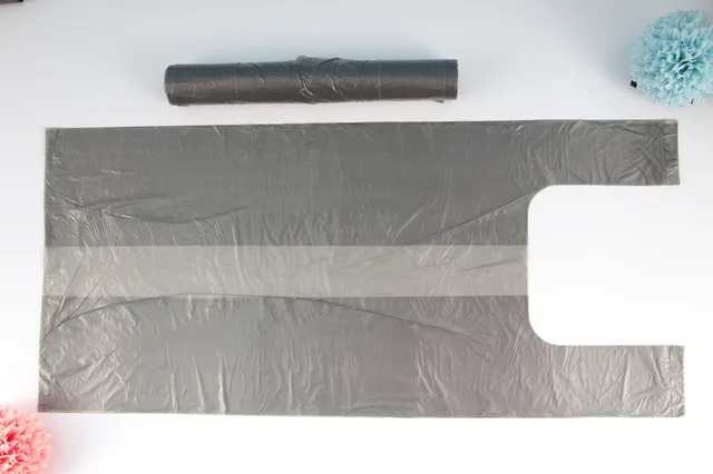 Grey t-shirt garbage bags on roll