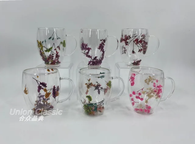 All clear double wall borosilicate glass mug inside with dry flower.